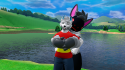 Me and my boyfriend standing in front of a lake as he holds me from behind.